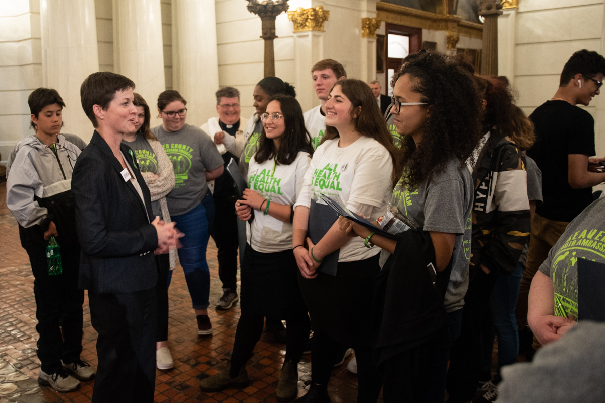 Youth mental health advocates speak with Department of
Human Services Secretary Teresa Miller in the Capitol
Rotunda on May 6.