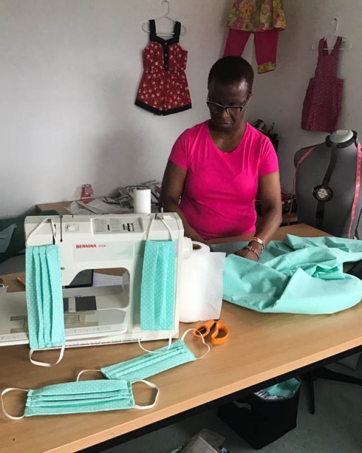 Catherine Mutunga sews masks in her home workshop.